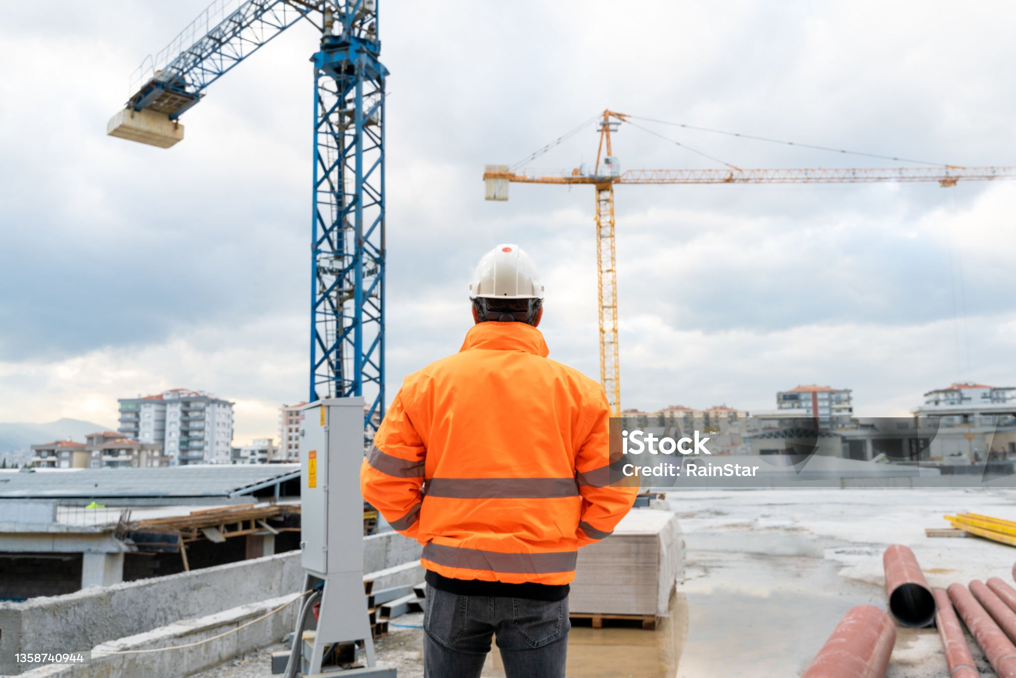 Civil engineer examines work at construction site